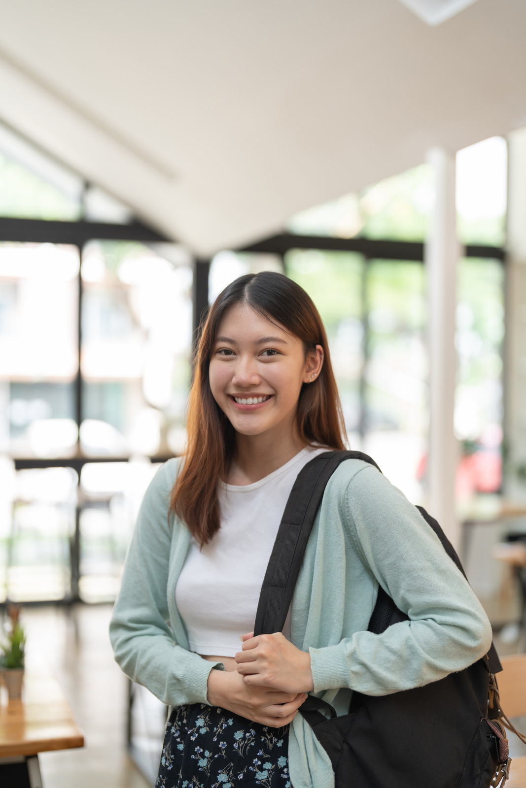 canva-portrait-young-asian-woman-student-holding-digital-tablet-at-MAFDY-OD-PQ